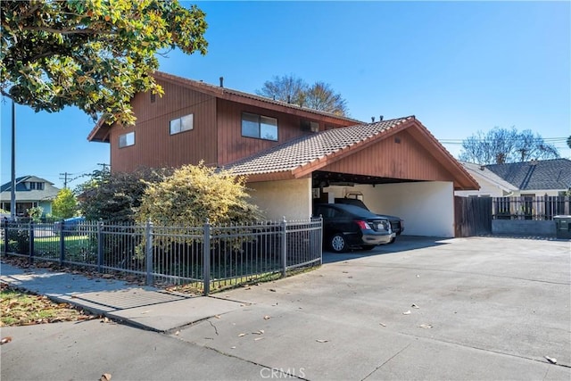 view of property exterior with a carport