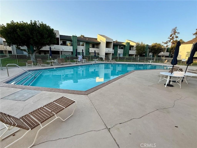 view of swimming pool with a patio