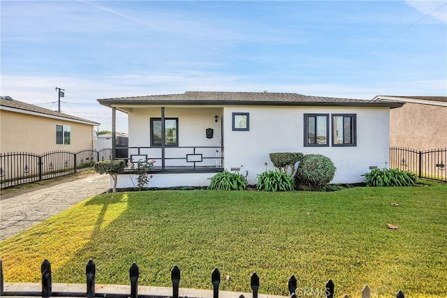 view of front of home with a porch and a front lawn