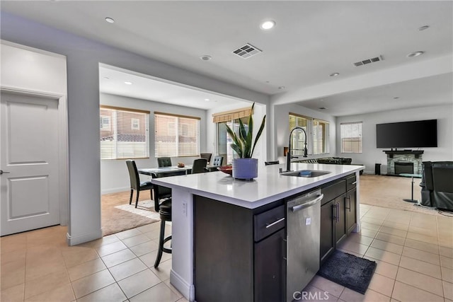 24469 Paxton Ln, Lake Elsinore, CA 92532 - kitchen with dishwasher, light carpet, light tile patterned flooring, open floor plan, and recessed lighting