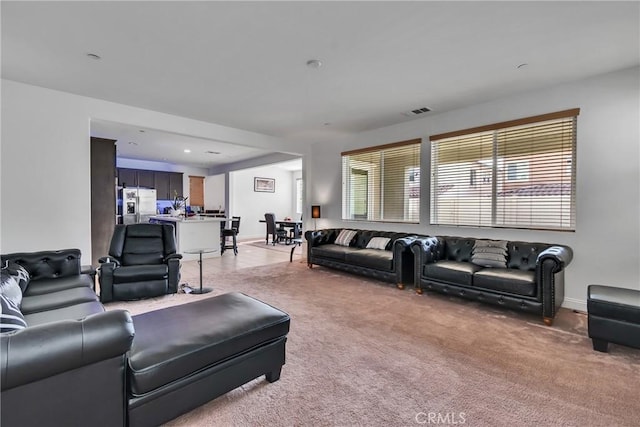 24469 Paxton Ln, Lake Elsinore, CA 92532 - living room featuring light carpet and baseboards