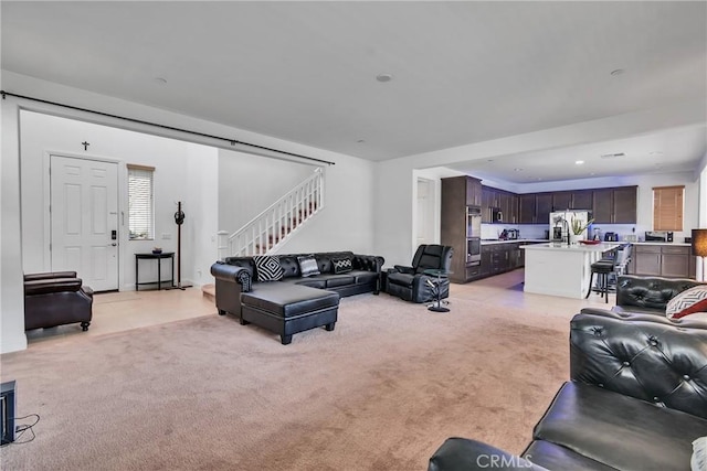 24469 Paxton Ln, Lake Elsinore, CA 92532 - living area with stairs and light carpet