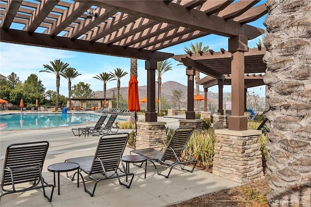 24469 Paxton Ln, Lake Elsinore, CA 92532 - view of patio with a pergola, a community pool, and a mountain view