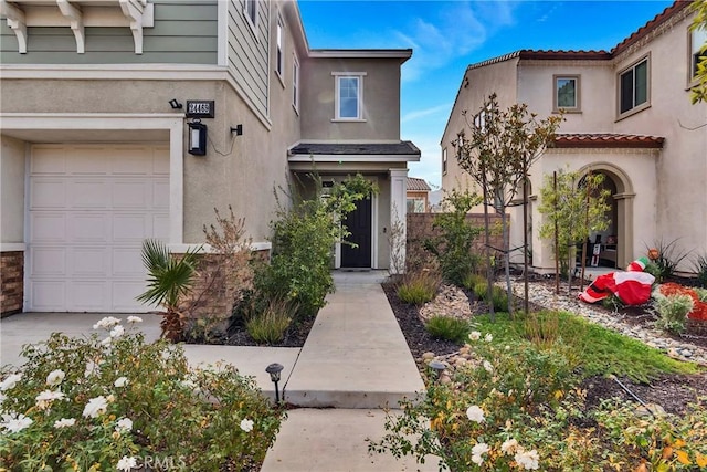24469 Paxton Ln, Lake Elsinore, CA 92532 - doorway to property with stucco siding and an attached garage