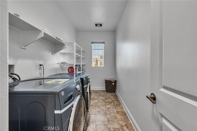 24469 Paxton Ln, Lake Elsinore, CA 92532 - laundry room with independent washer and dryer and stone finish flooring