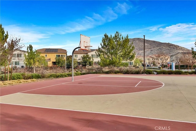 24469 Paxton Ln, Lake Elsinore, CA 92532 - view of basketball court featuring community basketball court, a mountain view, and a residential view