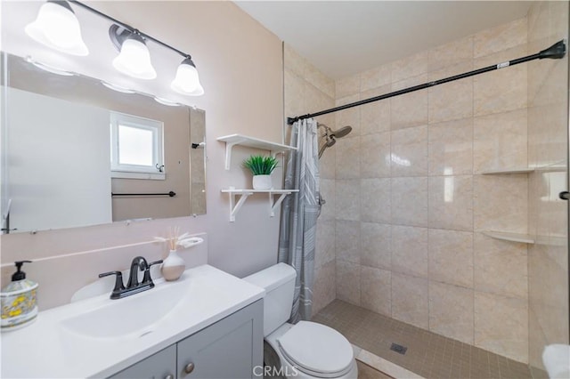 bathroom with toilet, vanity, and a shower with shower curtain