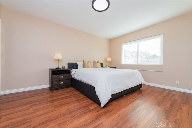 bedroom with hardwood / wood-style flooring