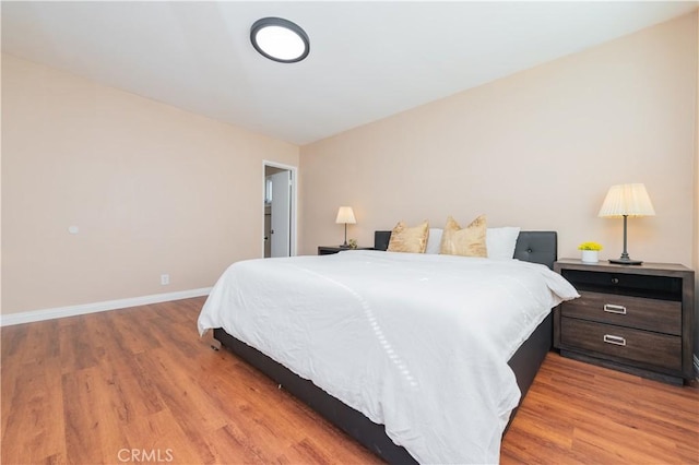 bedroom with light hardwood / wood-style floors