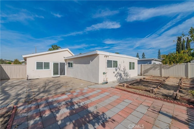 back of house with a patio area