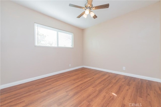 unfurnished room featuring ceiling fan and hardwood / wood-style floors