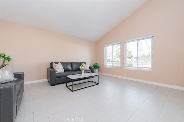 tiled living room featuring lofted ceiling