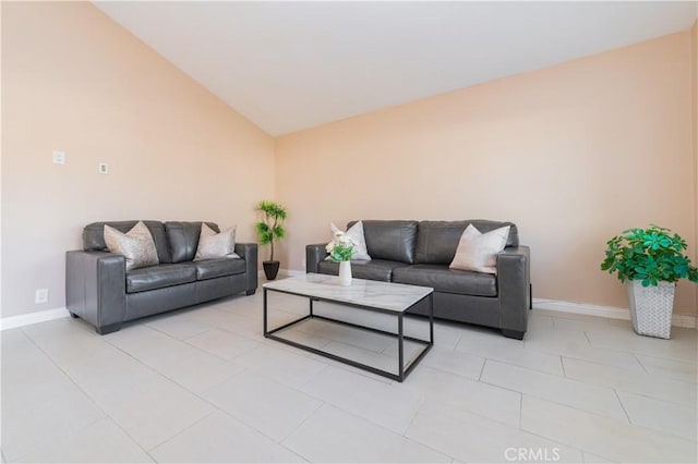 tiled living room featuring lofted ceiling