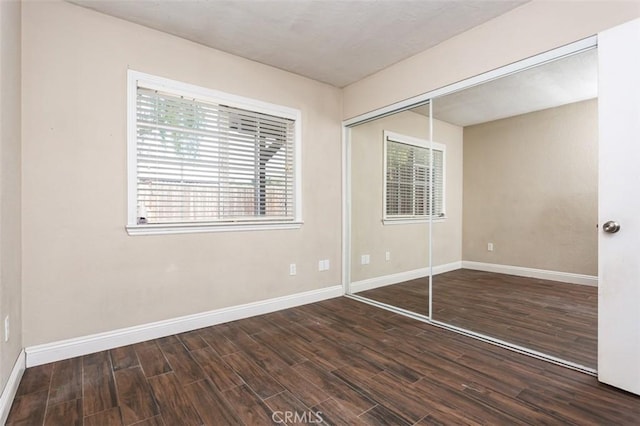 unfurnished bedroom with a closet