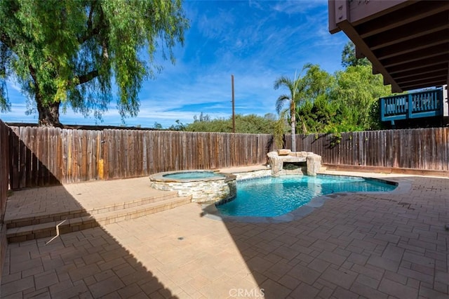 view of swimming pool featuring an in ground hot tub and a patio