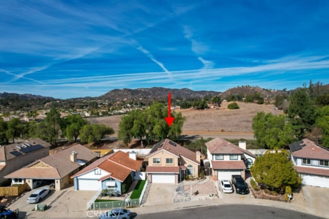 birds eye view of property with a mountain view