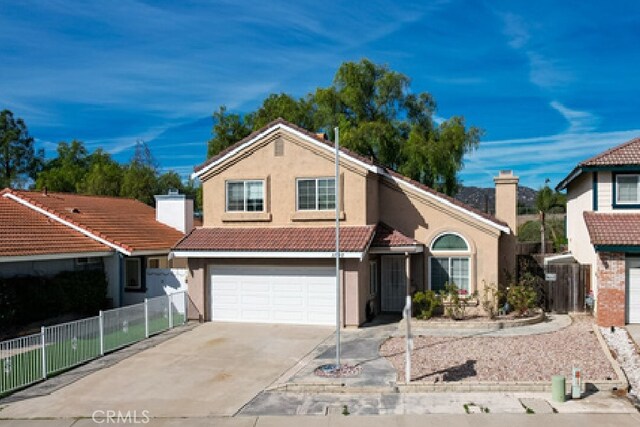 front of property with a garage