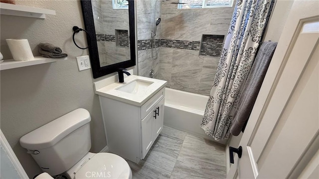 full bathroom with shower / bath combo with shower curtain, toilet, and vanity