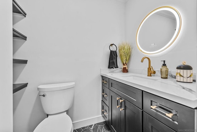 bathroom featuring toilet and vanity