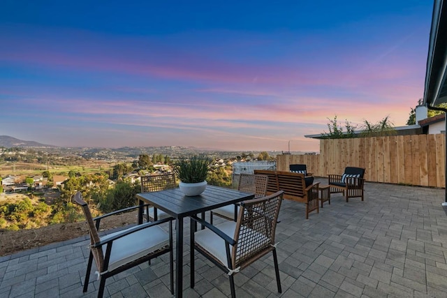 view of patio terrace at dusk