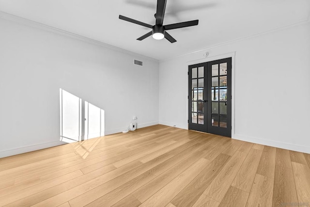 empty room with ceiling fan, french doors, ornamental molding, and light hardwood / wood-style floors