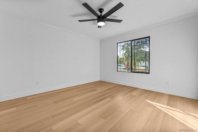 spare room with ceiling fan, crown molding, and light wood-type flooring