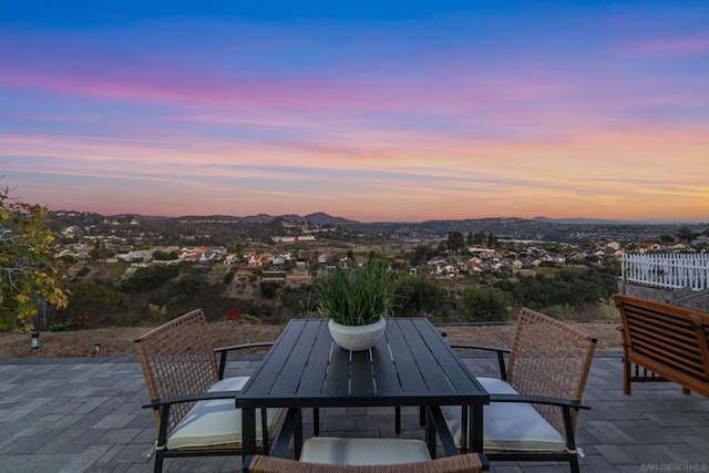 view of patio terrace at dusk