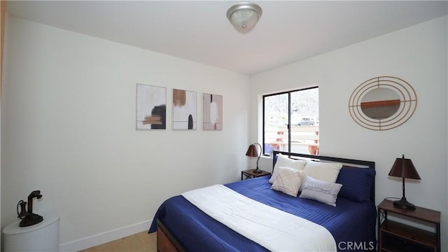 bedroom with wood-type flooring