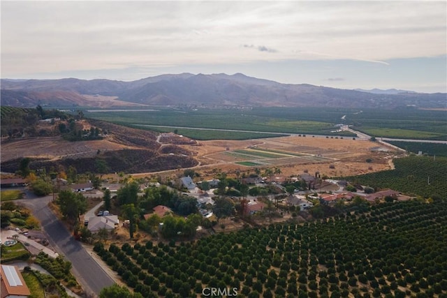 birds eye view of property featuring a mountain view and a rural view