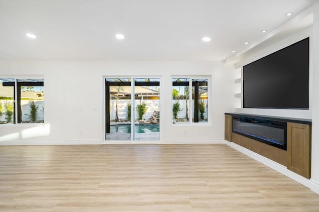 unfurnished living room featuring light hardwood / wood-style flooring