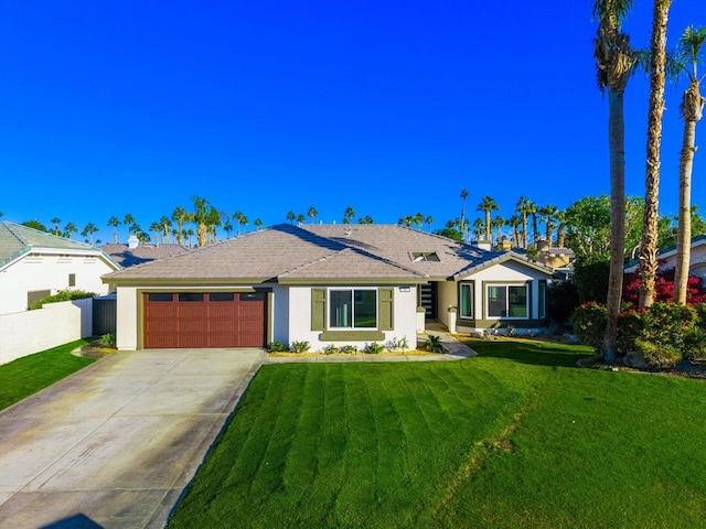 ranch-style home featuring a front lawn and a garage