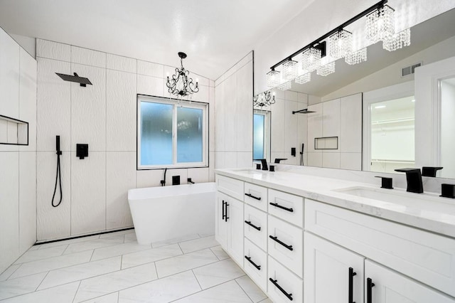 bathroom with lofted ceiling, vanity, tile walls, an inviting chandelier, and shower with separate bathtub