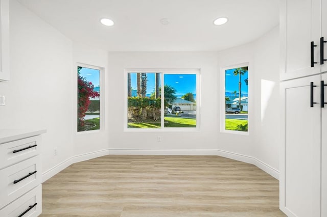 unfurnished room featuring light hardwood / wood-style floors