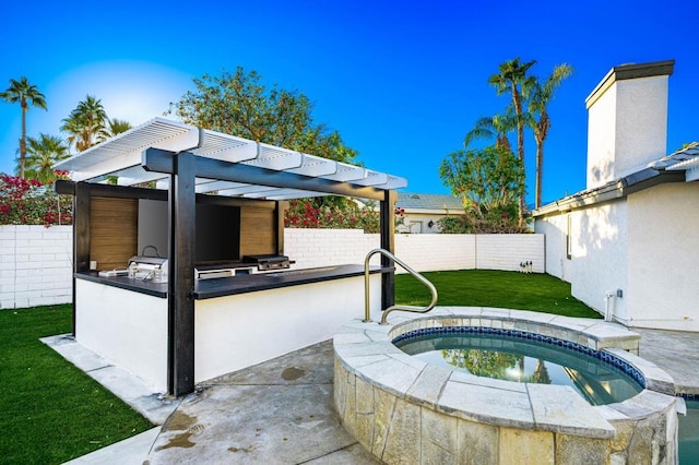 view of pool featuring an outdoor kitchen, a bar, a yard, and an in ground hot tub