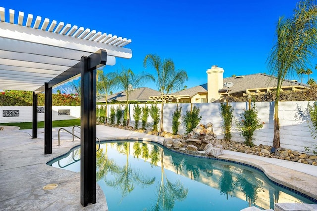 view of swimming pool with a pergola