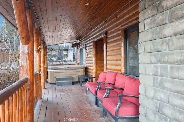 deck featuring a hot tub