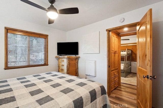 bedroom featuring ceiling fan and hardwood / wood-style floors