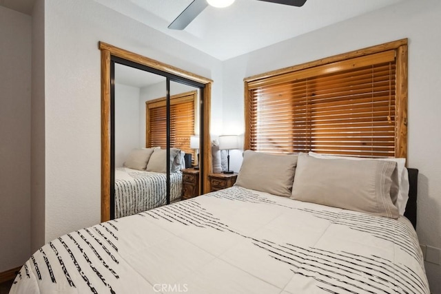 bedroom featuring ceiling fan and a closet