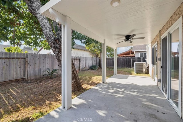 view of patio / terrace with ceiling fan, central AC unit, and a fenced backyard