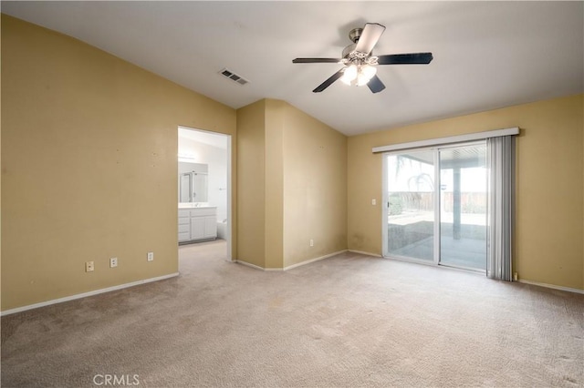 carpeted empty room with ceiling fan and lofted ceiling