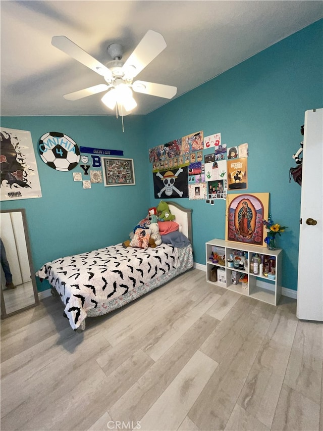 bedroom featuring ceiling fan and wood-type flooring