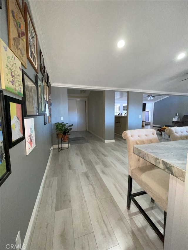 interior space with hardwood / wood-style flooring and crown molding