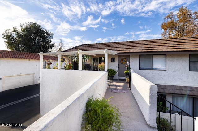 view of exterior entry with a garage