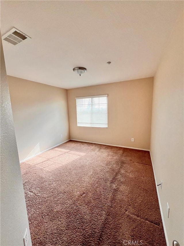 unfurnished room featuring carpet floors