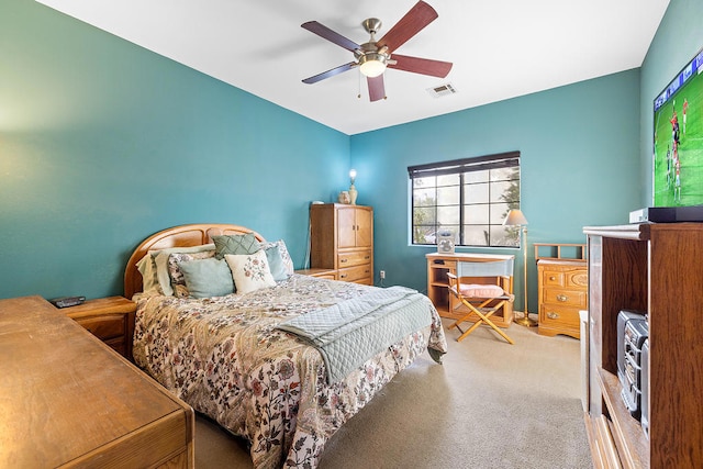 bedroom with ceiling fan and carpet