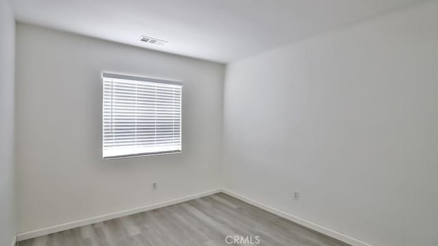 empty room with light wood-type flooring