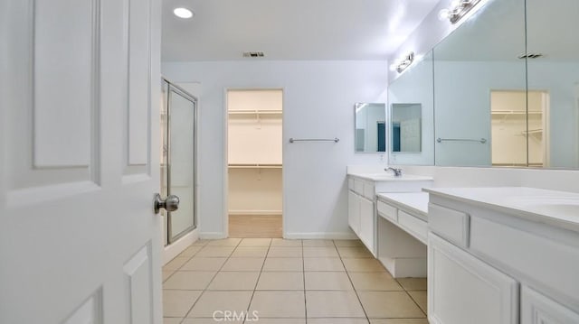 bathroom with vanity, tile patterned floors, and an enclosed shower