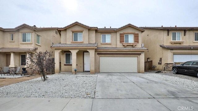 view of front of property with a garage