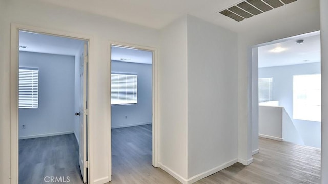 corridor featuring light wood-type flooring