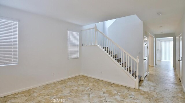 stairs featuring a wealth of natural light